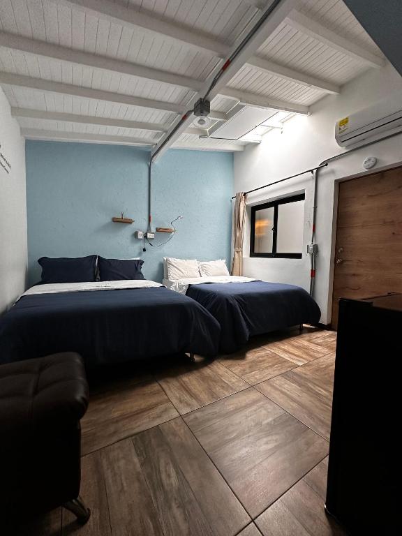 Postel nebo postele na pokoji v ubytování CoLinkHouse Hotel