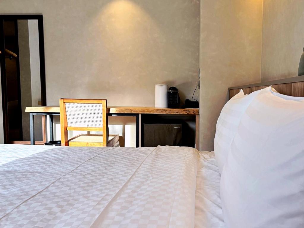 Postel nebo postele na pokoji v ubytování Hotel Initial-Tainan