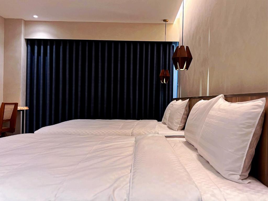 Postel nebo postele na pokoji v ubytování Hotel Initial-Tainan