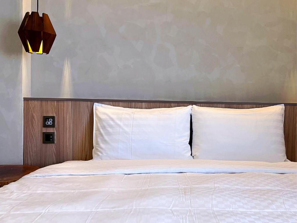 Postel nebo postele na pokoji v ubytování Hotel Initial-Tainan