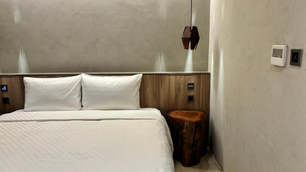 Postel nebo postele na pokoji v ubytování Hotel Initial-Tainan