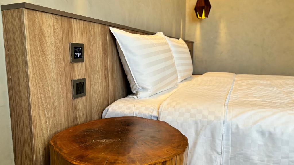 Postel nebo postele na pokoji v ubytování Hotel Initial-Tainan
