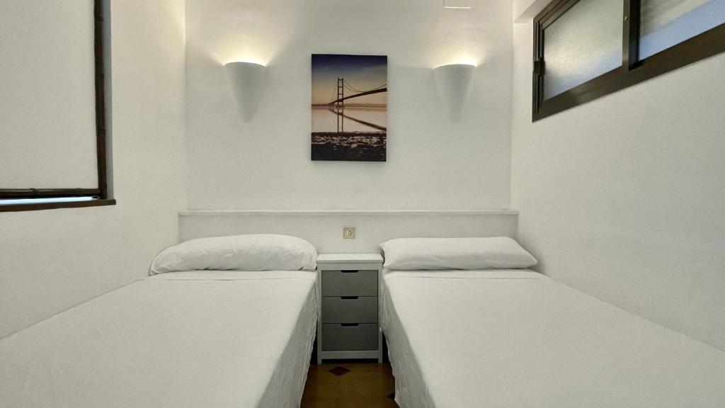 A bed or beds in a room at Jardins del mar 127