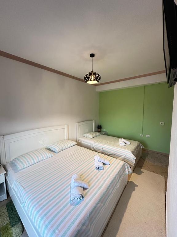 Postel nebo postele na pokoji v ubytování HOTEL VILA TOSKA
