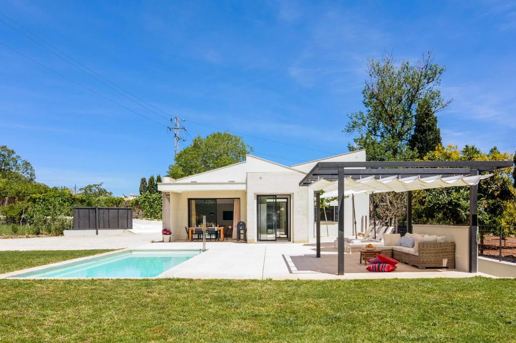a house with a pool and a pavilion at Hort Petit de Ternelles in Pollença