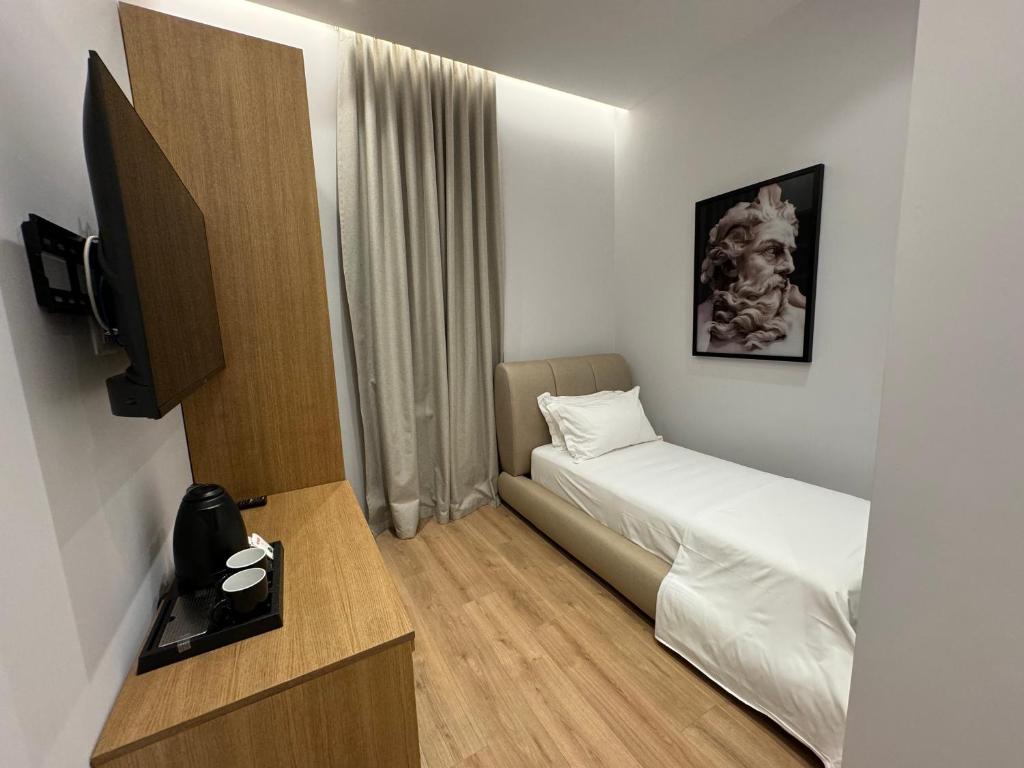 Postel nebo postele na pokoji v ubytování Hotel Vila Zeus
