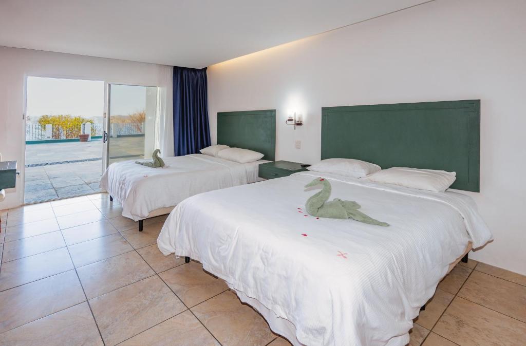 Postel nebo postele na pokoji v ubytování Dunama Hotel