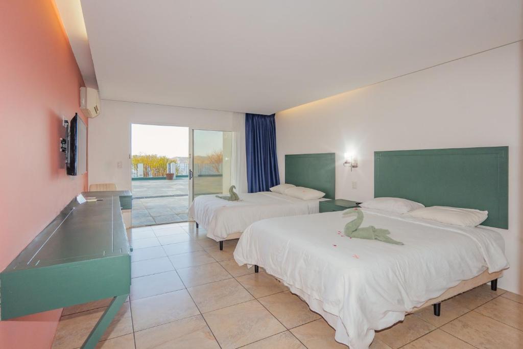 Postel nebo postele na pokoji v ubytování Dunama Hotel