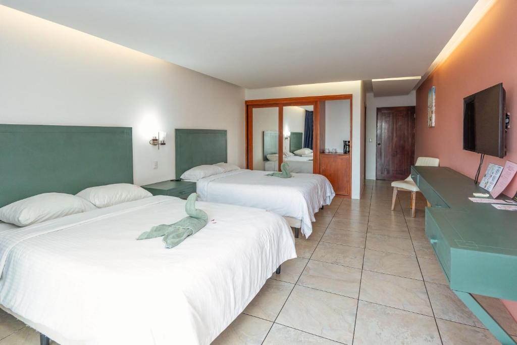 Postel nebo postele na pokoji v ubytování Dunama Hotel