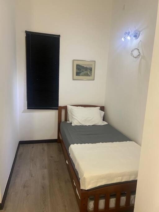 Postel nebo postele na pokoji v ubytování F Homestay Putrajaya Near to PICC