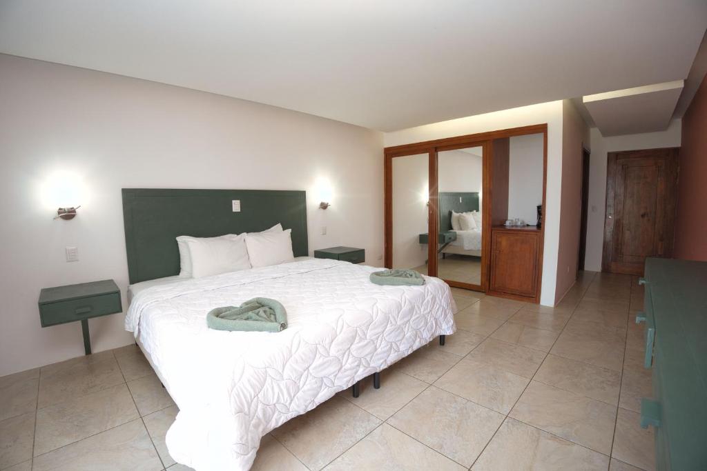 Postel nebo postele na pokoji v ubytování Dunama Hotel