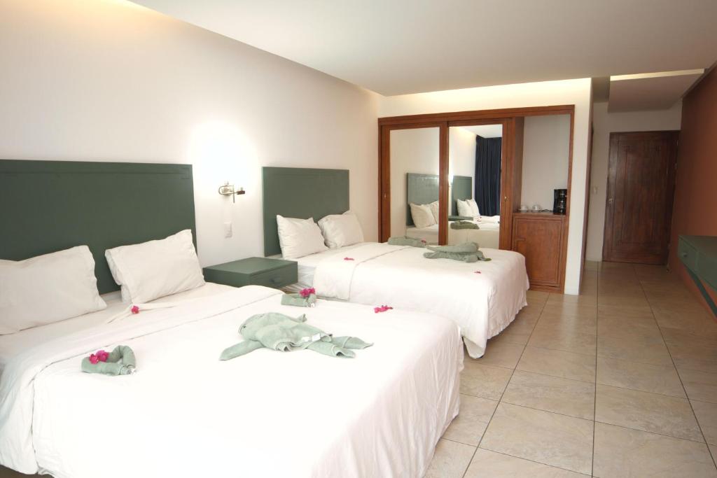 Postel nebo postele na pokoji v ubytování Dunama Hotel