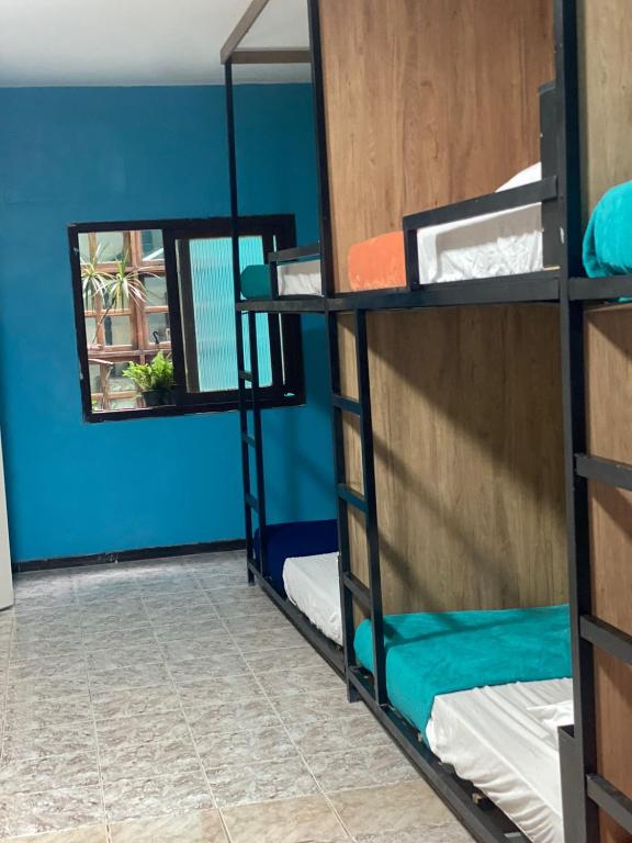 Postel nebo postele na pokoji v ubytování Meraki Hostel e Turismo