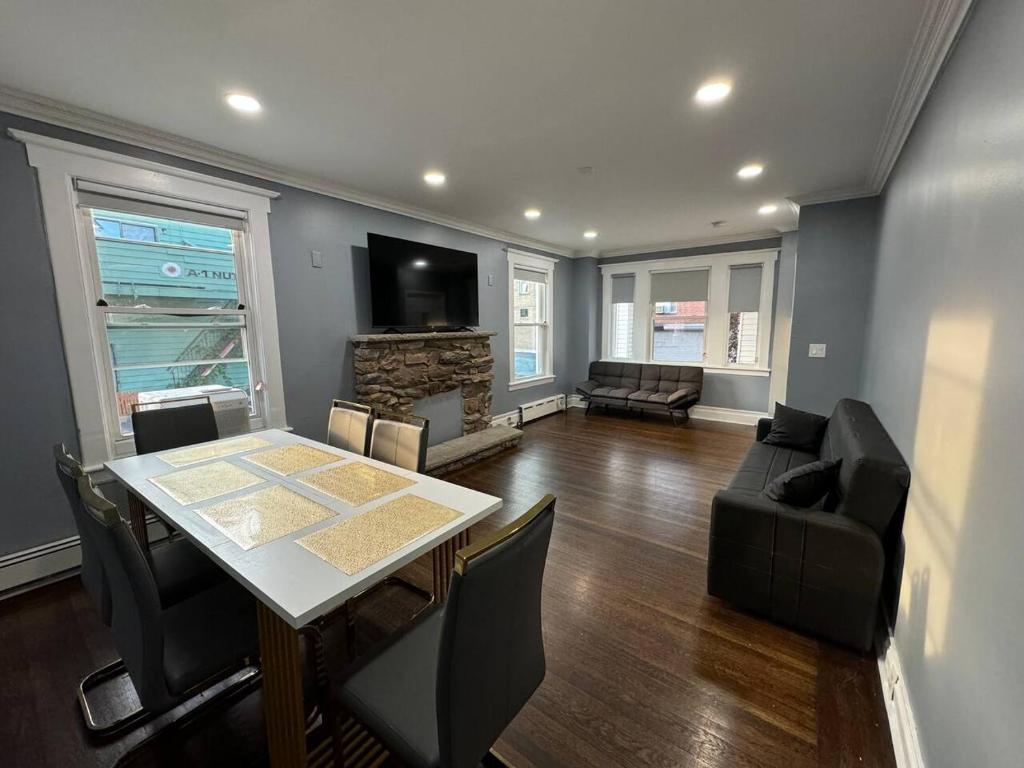 a living room with a table and a couch at Large family home Near NYC in Passaic