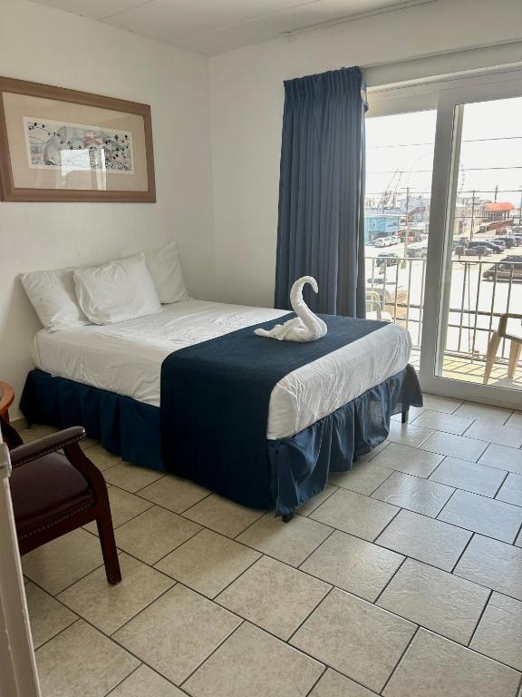 Postel nebo postele na pokoji v ubytování Brittany Motel