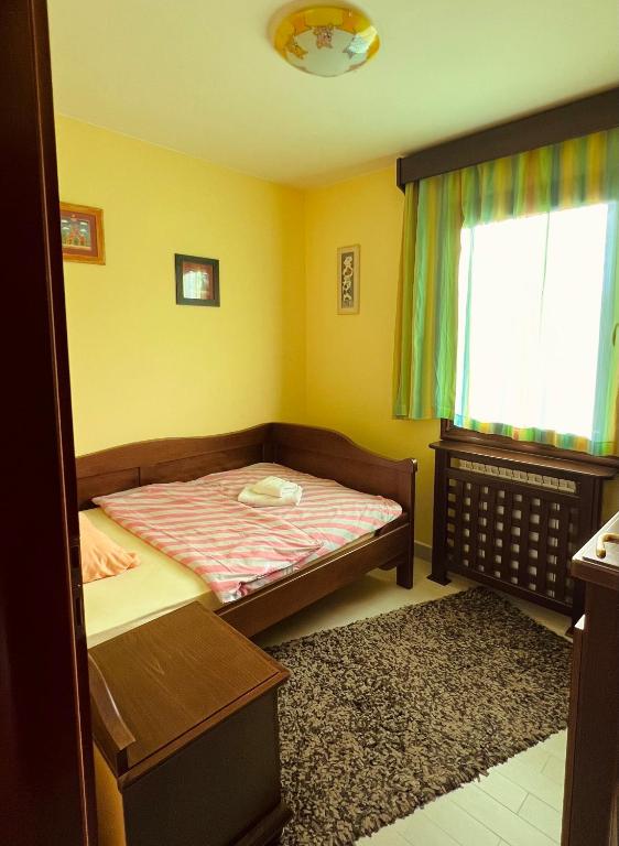 Postel nebo postele na pokoji v ubytování Vila Milena
