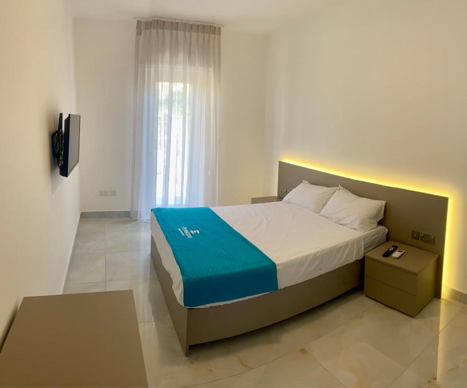 Postel nebo postele na pokoji v ubytování Penelope Apartments 15