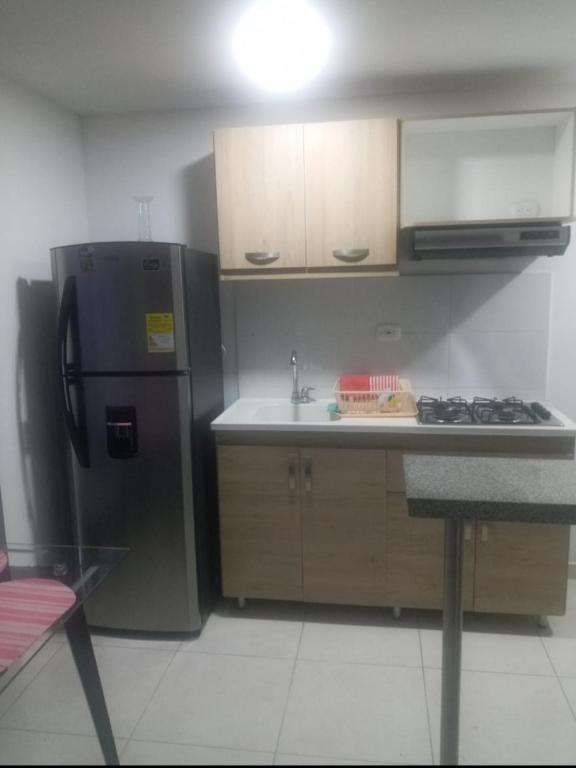 Kuchyň nebo kuchyňský kout v ubytování Acogedor y Agradable Apartaestudio en Campus 67