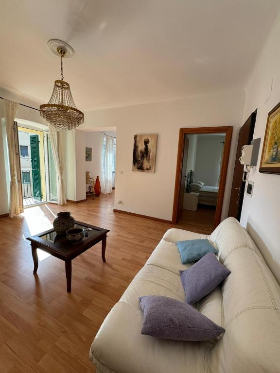 a living room with a couch and a table at Casa Giulia in Genoa
