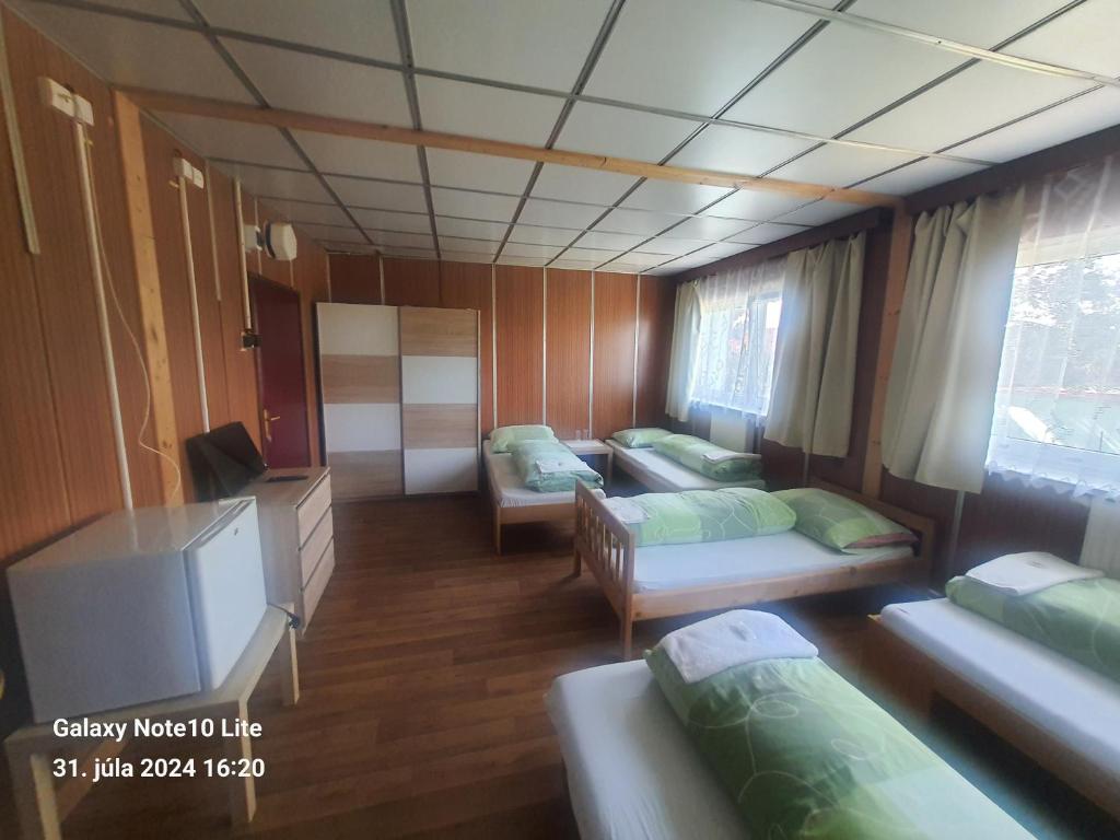 Postel nebo postele na pokoji v ubytování Motorest u Janíčkov