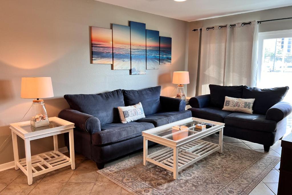 a living room with a couch and a table at Perdido Dunes #27 in Orange Beach