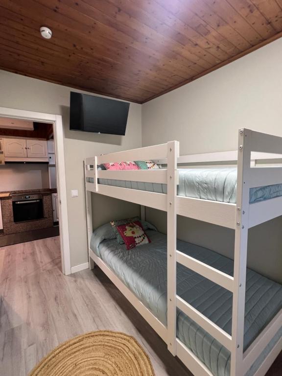 Postel nebo postele na pokoji v ubytování Chalet playa Rianxo
