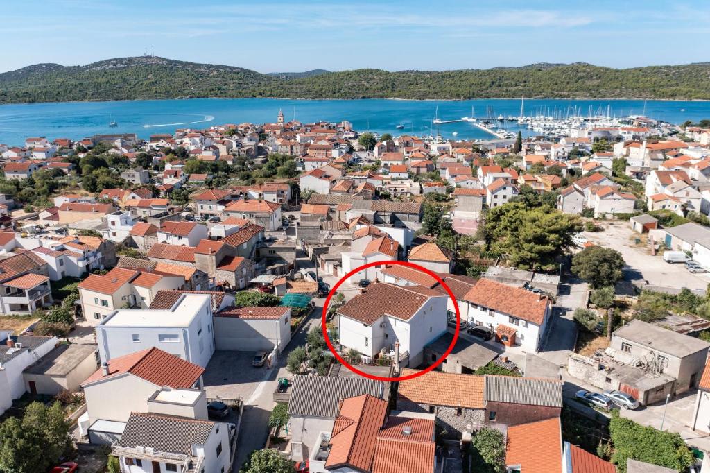an aerial view of a town with a red circle at Apartments with a parking space Pirovac, Sibenik - 13201 in Pirovac