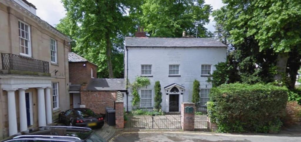 an image of a white house at St Julians house in Shrewsbury