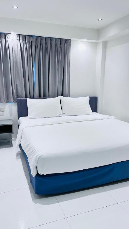Postel nebo postele na pokoji v ubytování My Hotel Pratunam