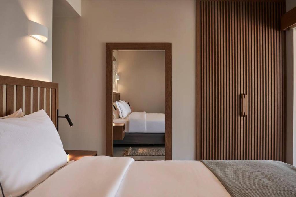 A bed or beds in a room at Beachfront Alassa Villas with Private Pools