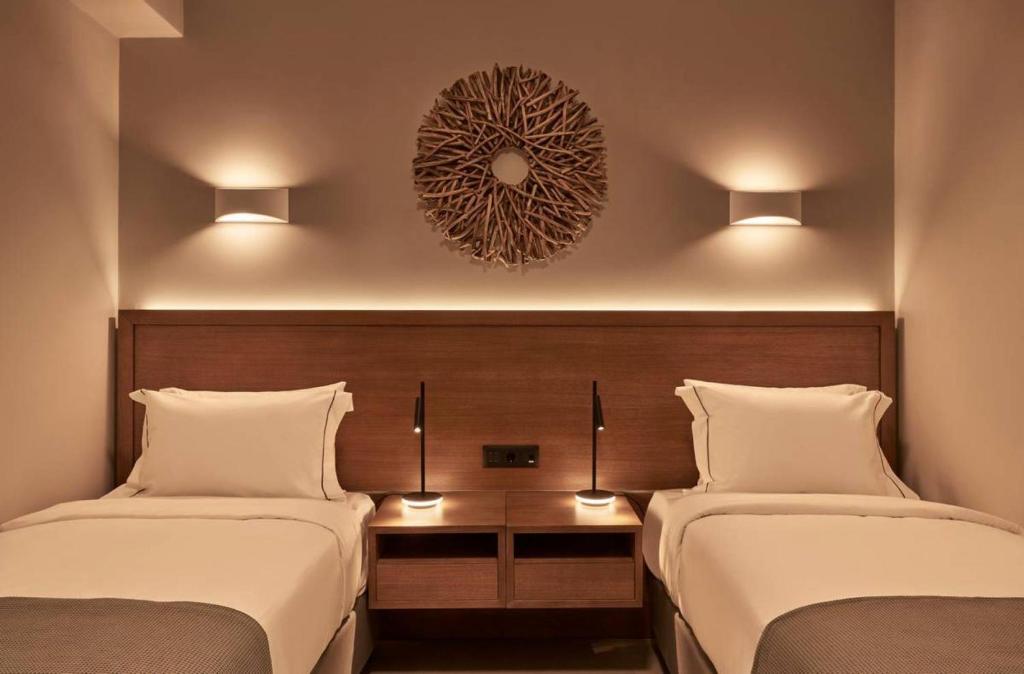 A bed or beds in a room at Beachfront Alassa Villas with Private Pools