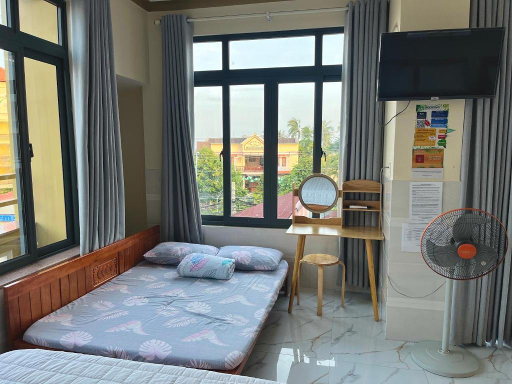 Giường trong phòng chung tại T'H Homestay