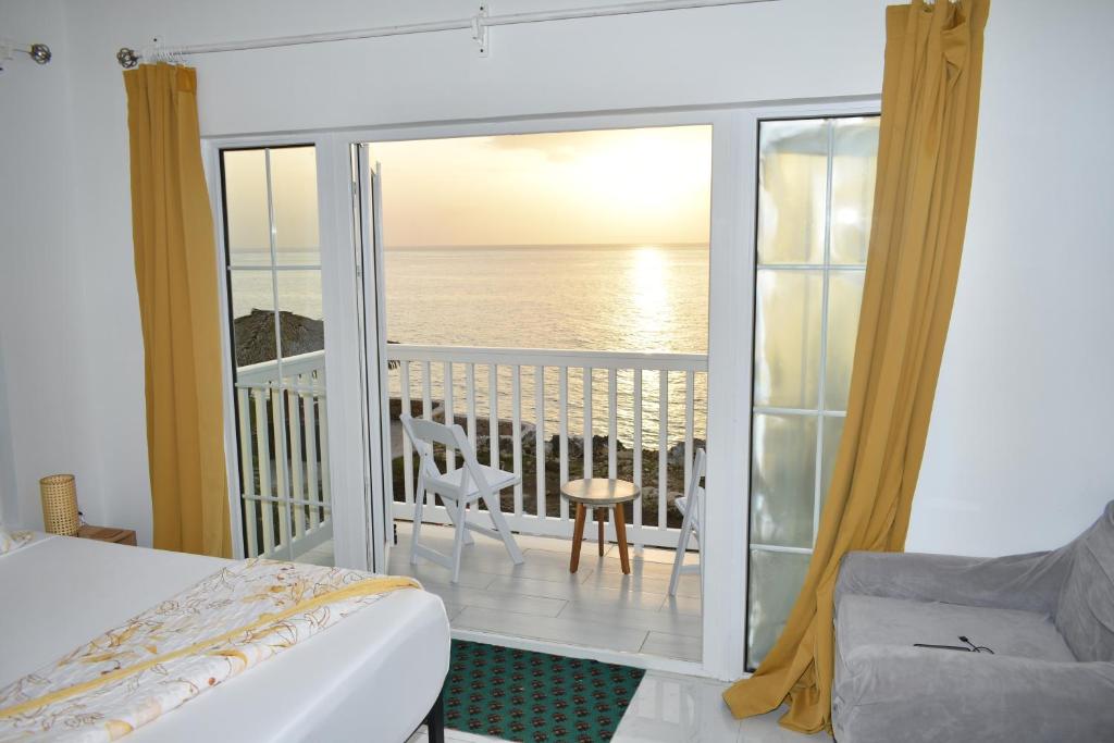Postel nebo postele na pokoji v ubytování Irie Vibes Ocean View