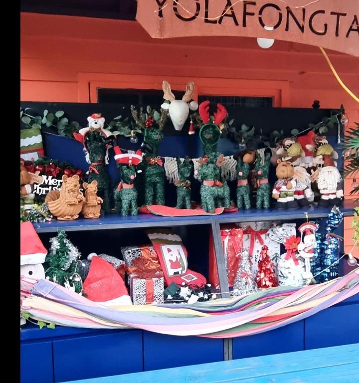 a shelf filled with christmas ornaments and presents at Pocheon Yolafongta Pension in Pocheon