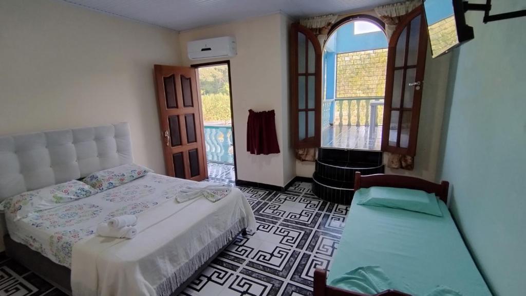 Postel nebo postele na pokoji v ubytování Hotel Alto Amazonas