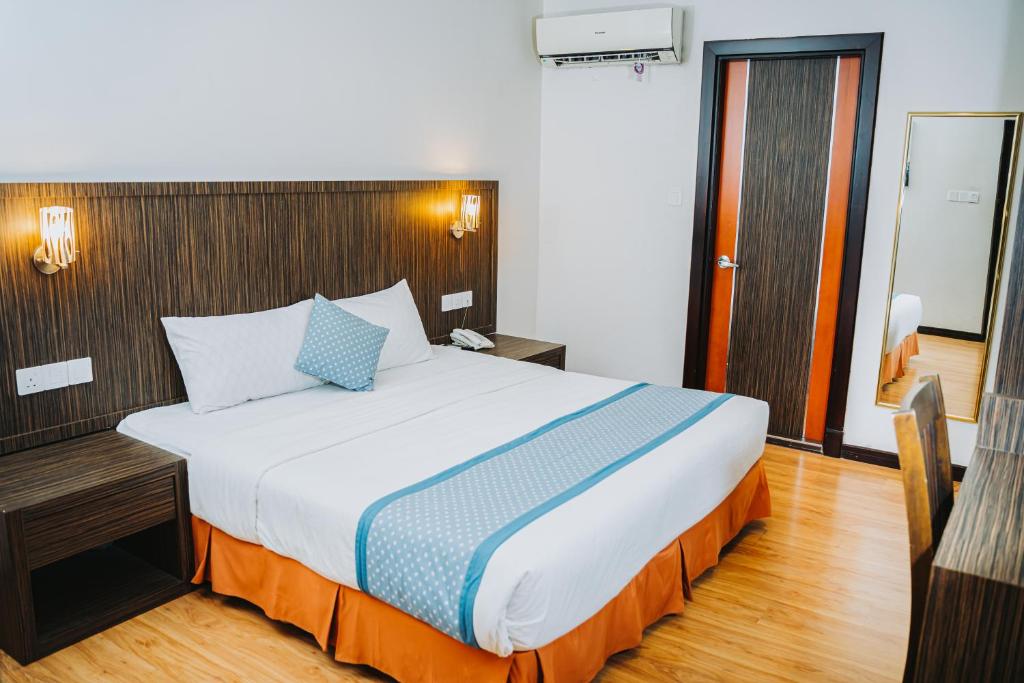 Postel nebo postele na pokoji v ubytování Hotel Nur Miri