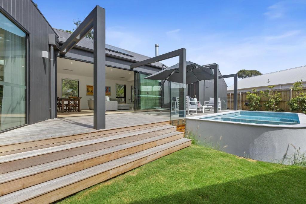 an external view of a house with a swimming pool at Villa Aquarius - Gas Heated Pool Spa Luxury in Blairgowrie