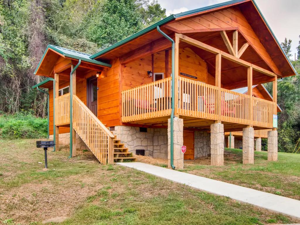 a log cabin with a staircase leading up to it at River Romance #2328 in Pigeon Forge
