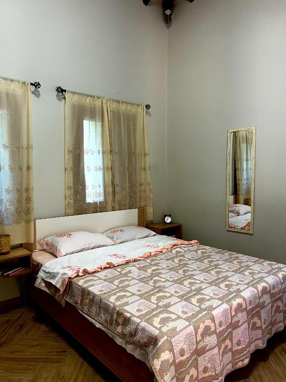 Postel nebo postele na pokoji v ubytování Niki Cottage
