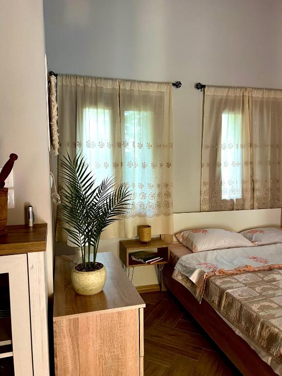 Postel nebo postele na pokoji v ubytování Niki Cottage