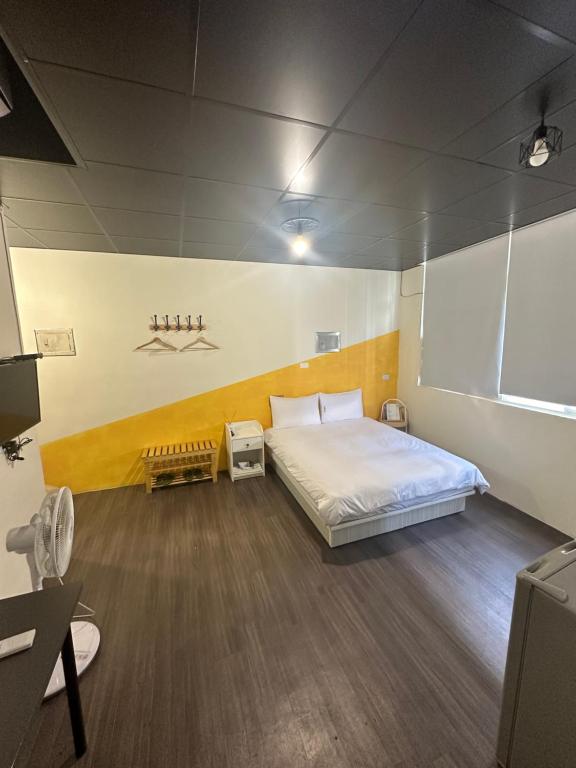 Letto o letti in una camera di 好客輕旅