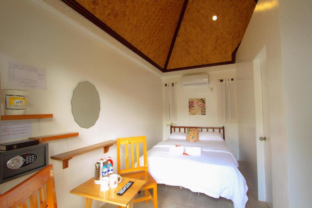 Postel nebo postele na pokoji v ubytování Sunz en Coron Resort