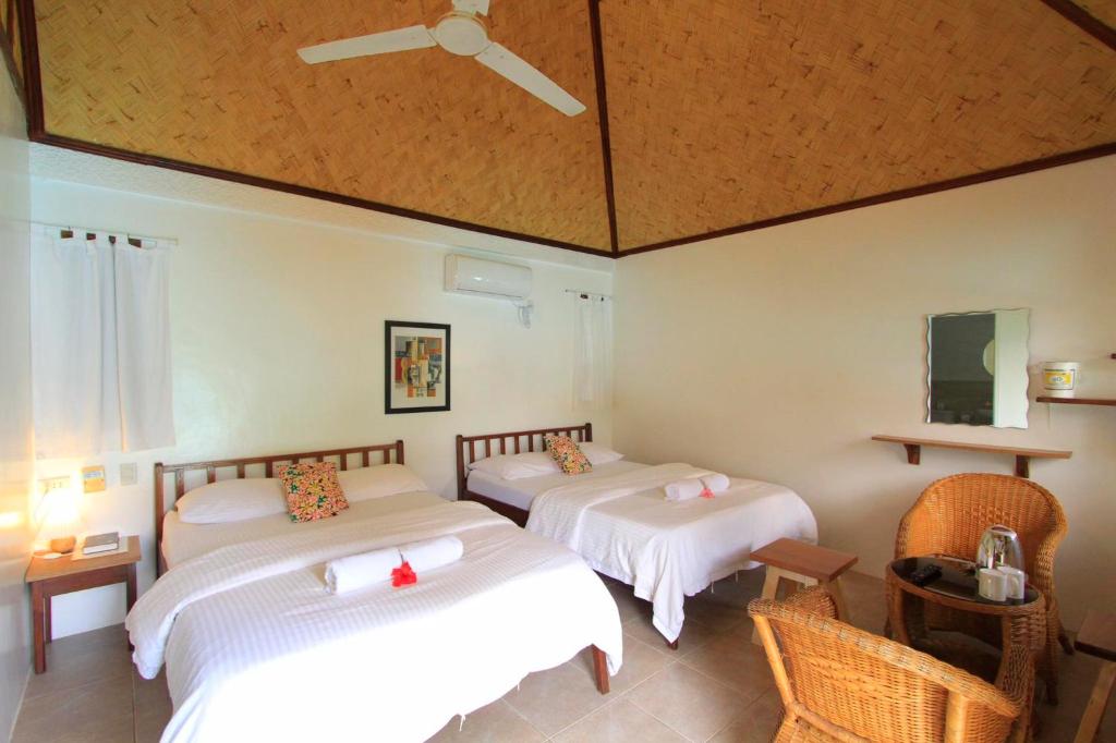 Postel nebo postele na pokoji v ubytování Sunz en Coron Resort
