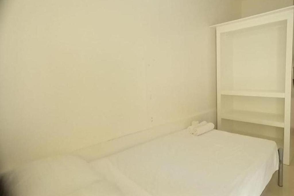 Postel nebo postele na pokoji v ubytování Palajuanders Inn Palawan