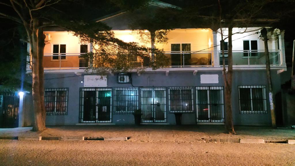 a building with a bunch of windows in front of it at Chez Nous in Pointe-Noire