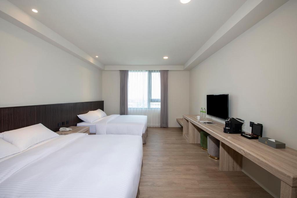 Postel nebo postele na pokoji v ubytování Floramos Hotel