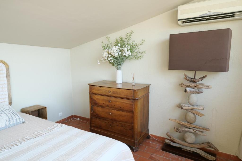 Letto o letti in una camera di Chambres du Vieux Bistrot