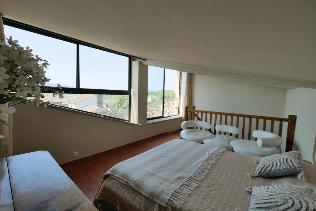 Letto o letti in una camera di Chambres du Vieux Bistrot