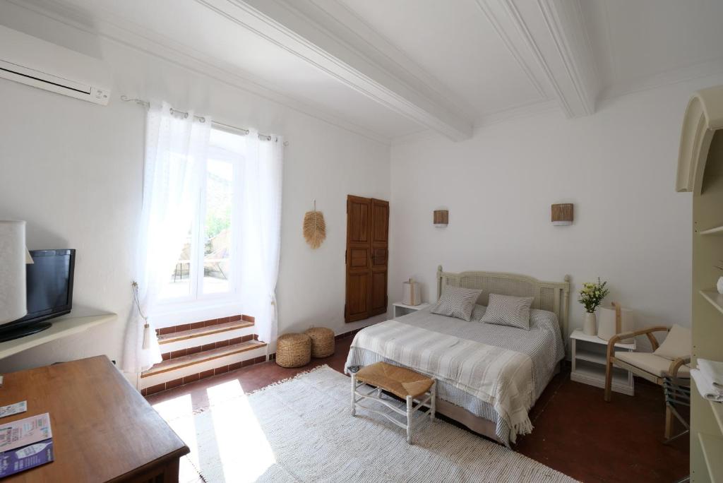 Letto o letti in una camera di Chambres du Vieux Bistrot