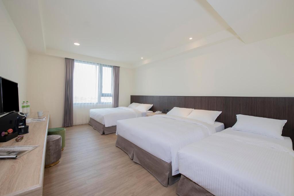 Postel nebo postele na pokoji v ubytování Floramos Hotel